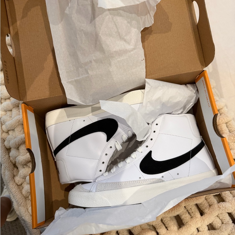 Nike women’s White and Black High-Top Sneakers